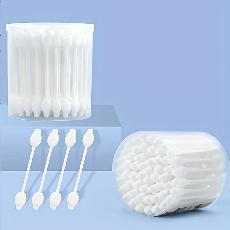 A collection of white gentle pet ear cleaning cotton swabs is shown in various arrangements.