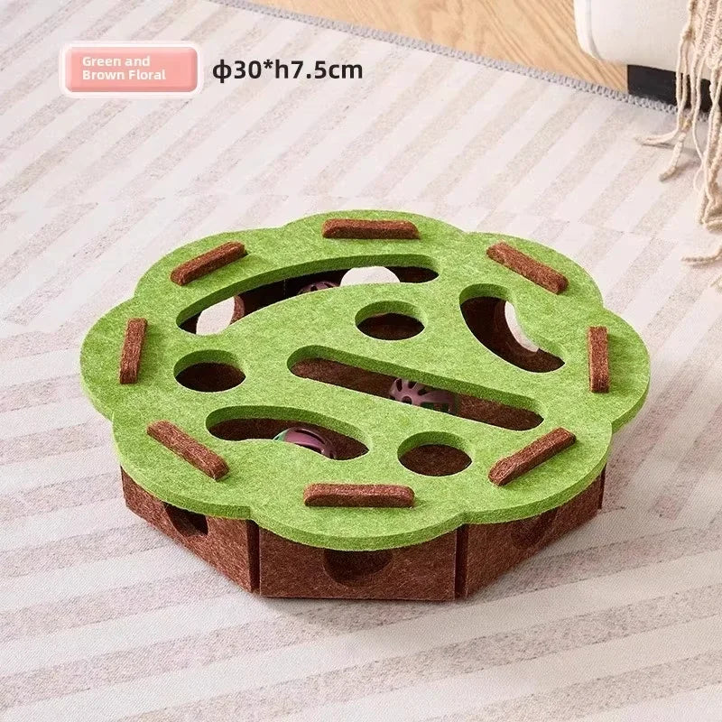 A green wooden puzzle toy shaped like a cat, featuring holes for indoor play.