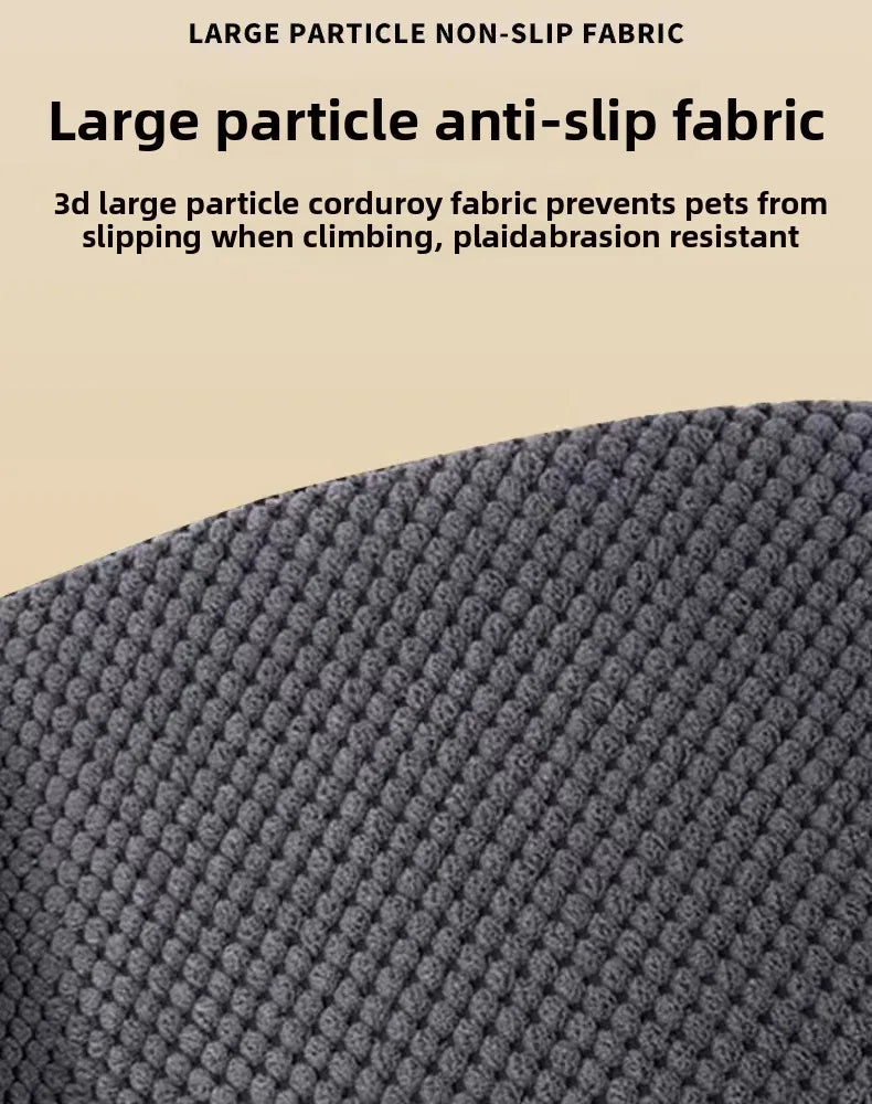 Close-up view of a dark gray, textured non-slip fabric surface for pet stairs.