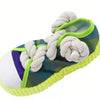 A green and purple patterned slipper dog chew toy featuring a thick white rope handle.