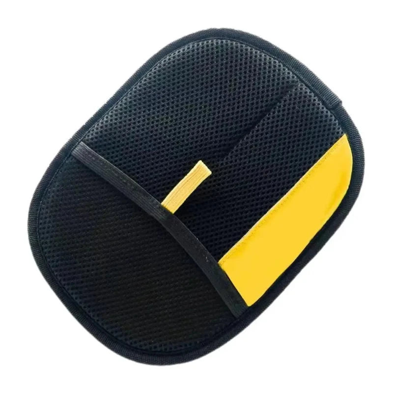 Black reusable pet hair remover glove with a yellow cleaning mitt visible from above.