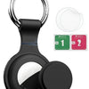 A black silicone AirTag protective cover with a keyring and two replacement wipes.