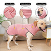 A golden retriever wearing a pink fleece dog sweater with a high collar, demonstrating warmth and elasticity.
