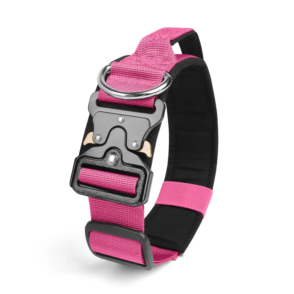 A pink and black durable tactical dog collar with a silver buckle and padded strap.