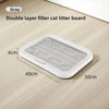 A gray double layer filter cat litter board with anti-slip base shown on a wooden floor.