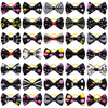 A collection of adorable pet hair bows featuring various patterns and colors tied with gentle rubber bands.