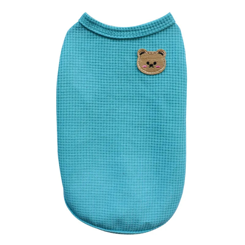 A teal knitted pet shirt for small dogs or cats featuring a brown bear face patch.