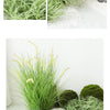 Collection de plantes et roches miniatures de jardin simulées, vert et blanc.