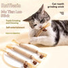 A tabby cat is using a natural wooden teeth grinding stick for self-entertainment and dental cleaning.