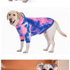 A dog wearing a tie-dye fleece hoodie in various colors and styles.