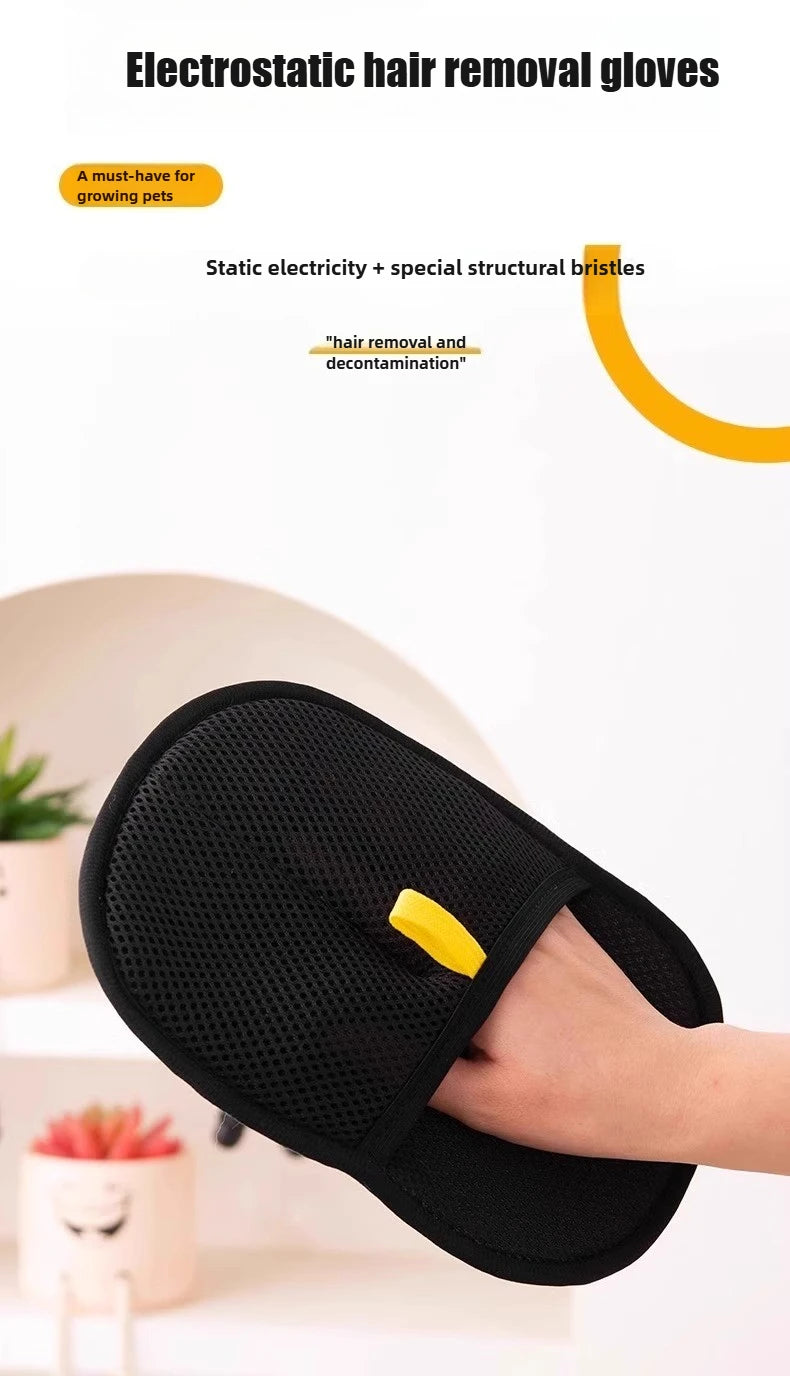 A hand wearing a black electrostatic hair removal glove for pet grooming is shown against a white background.