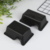 Black reptile and small animal hide box with a square grid in the background