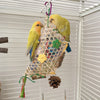 A yellow parrot toy with a bamboo frame filled with colorful shredded paper and natural elements.