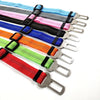 A collection of colorful reflective dog seat belts with nylon harnesses and metal buckles.