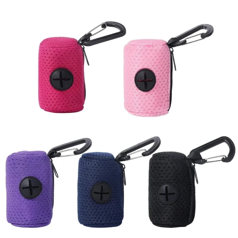 A set of reusable dog poop bags in pink, purple, and black with metal clasps.