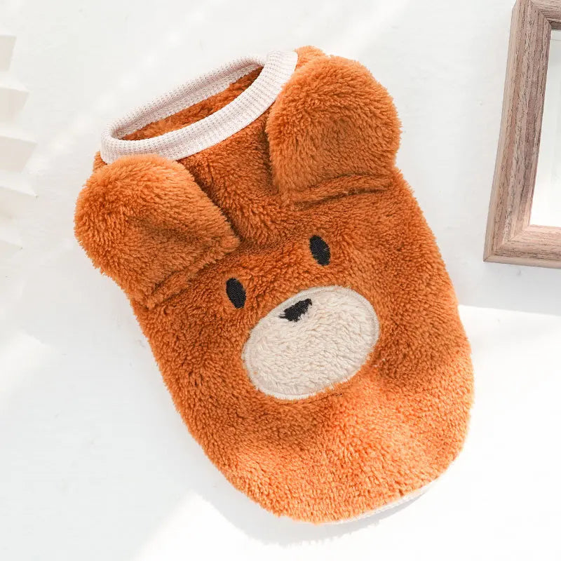 A fluffy, orange fleece puffer vest designed for small dogs and cats.