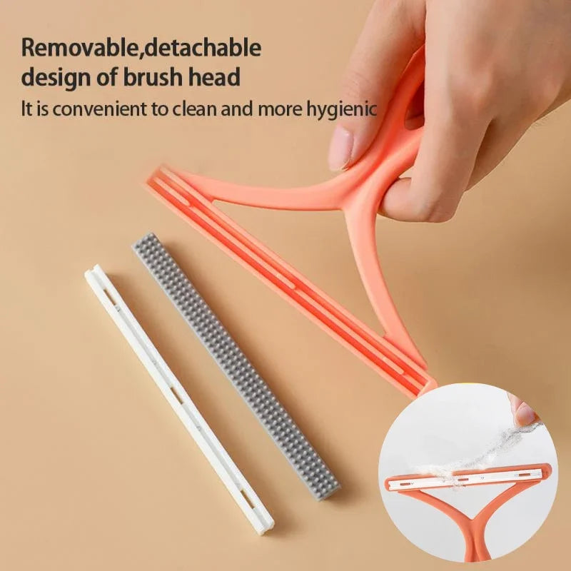 A hand holds an orange plastic tool with a removable brush head, showing the detachable design of a pet hair remover.