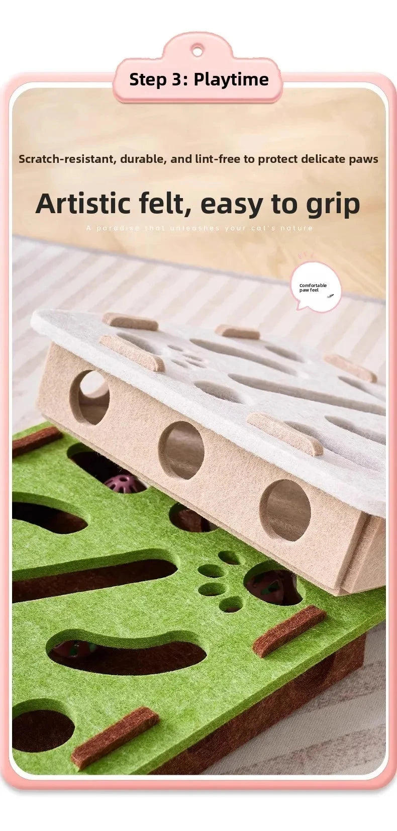 A cat puzzle toy featuring artistic felt pieces and a green base for indoor playtime.