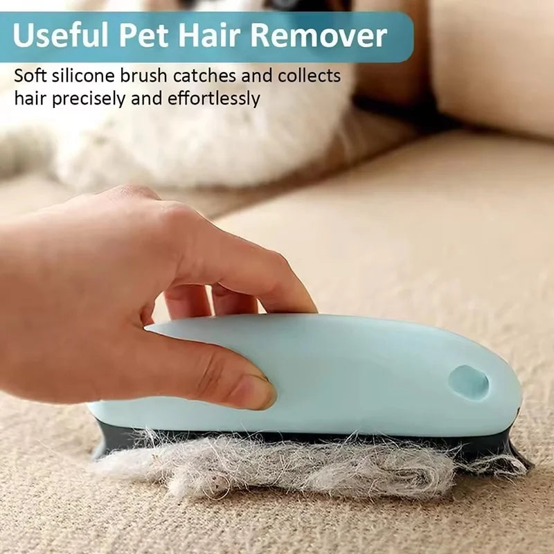A hand is using a light blue silicone brush to remove pet hair from a surface.