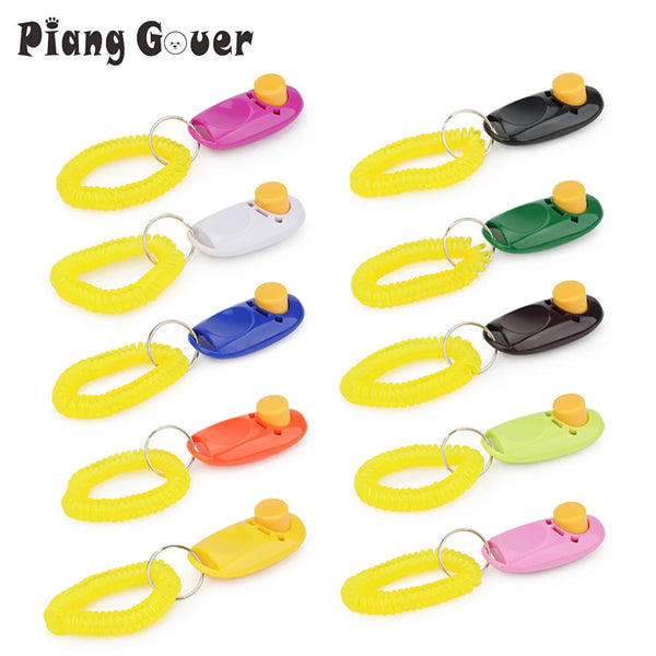 A collection of colorful dog training clickers with yellow and black elastic loops.