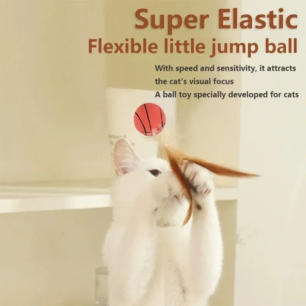 A white cat is interacting with a red ball toy designed for cats.