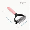 Large pink stainless steel pet grooming comb with a black handle and teeth