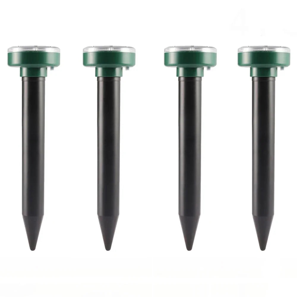 Four black ultrasonic pest repellers with green tops shown vertically