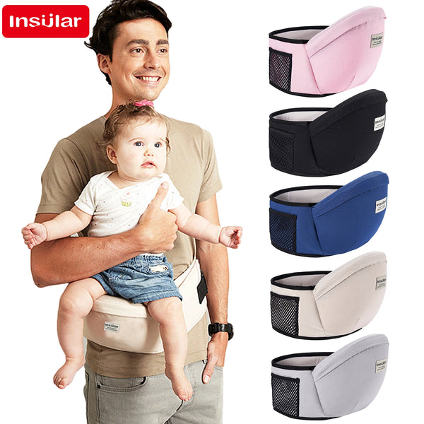 A man is holding a baby in an Insular adjustable baby carrier hip seat sling.