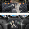 A waterproof dog car seat cover with a mesh window allowing visibility and side zippers installed in a vehicle interior.