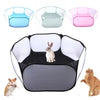A portable pet playpen with multiple colored plastic enclosures and a large black mesh enclosure containing a small rabbit an