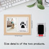 A wooden frame displaying two framed pet footprints, one showing a dog and the other a silhouette.