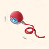 A red, spherical interactive cat toy ball with a clear lens and flexible cord is shown against a light background.