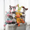 A collection of handmade plush donkey toys in various colors and textures displayed in a black wire cage.