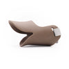 A tan silicone dog muzzle designed for small to medium dogs, featuring a flexible design and a padded strap.