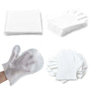 Guantes desechables blancos para quitar el pelo de mascotas, apilados y a la venta