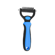 A blue and black all-in-one pet deshedding grooming comb with a metal comb attachment.