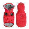 A red, quilted hooded jacket for a dog with a gray sherpa lining and a waterproof shell.