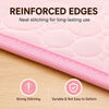 Close-up of a pink quilted mat showing reinforced edges and strong stitching for long-lasting use