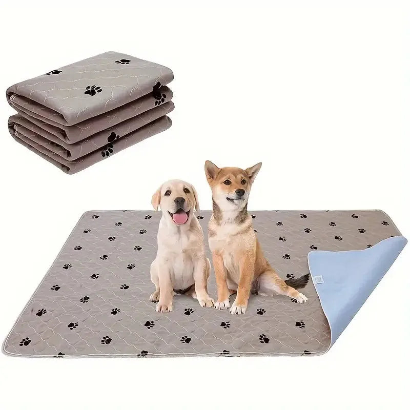 Stack of gray washable reusable dog urine pads next to a single light brown dog sitting on a gray mat.