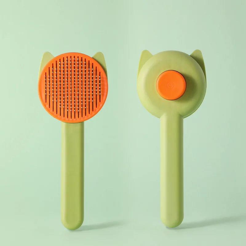 A light green pet hair removal brush with an orange silicone head and a yellow handle.