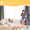 A young girl is playing with a dog and squeaky chew balls indoors.