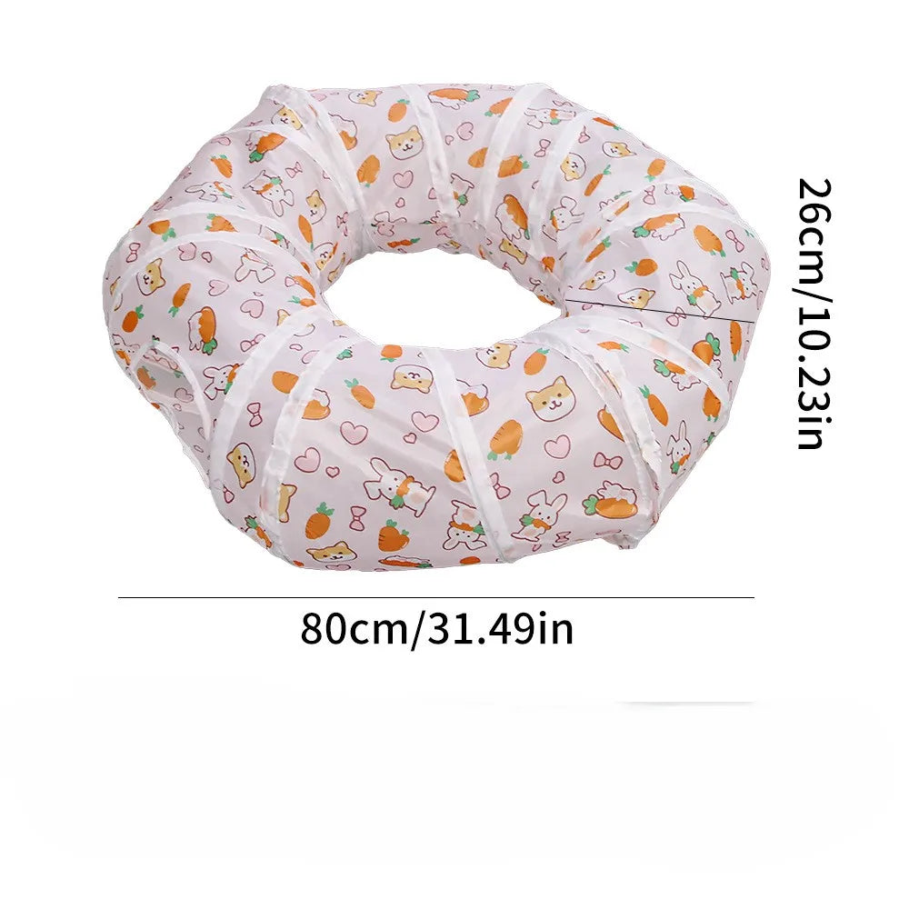 A light pink foldable cat play tunnel with a pattern of orange and white cats