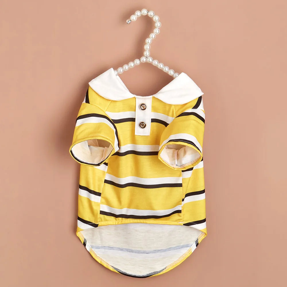 A yellow and black striped polo shirt for a small dog, displayed against a neutral background.