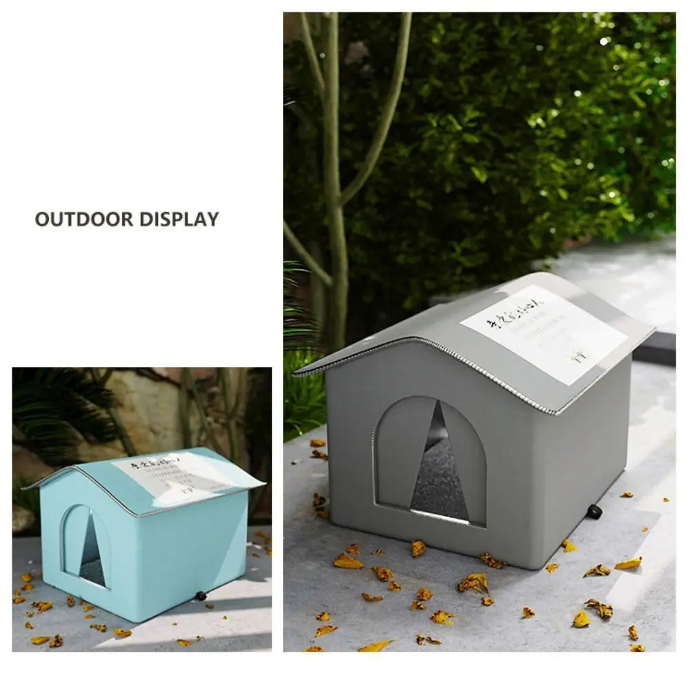 A gray foldable waterproof insulated cat house displayed outdoors on a light surface.