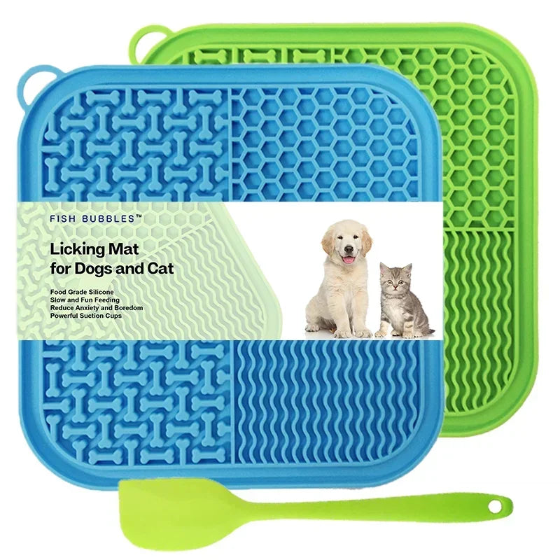 A blue silicone licking mat for dogs and cats with suction cups and a green silicone spoon.