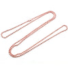 A set of delicate rose gold plated ball bead necklaces laid out on a white background.