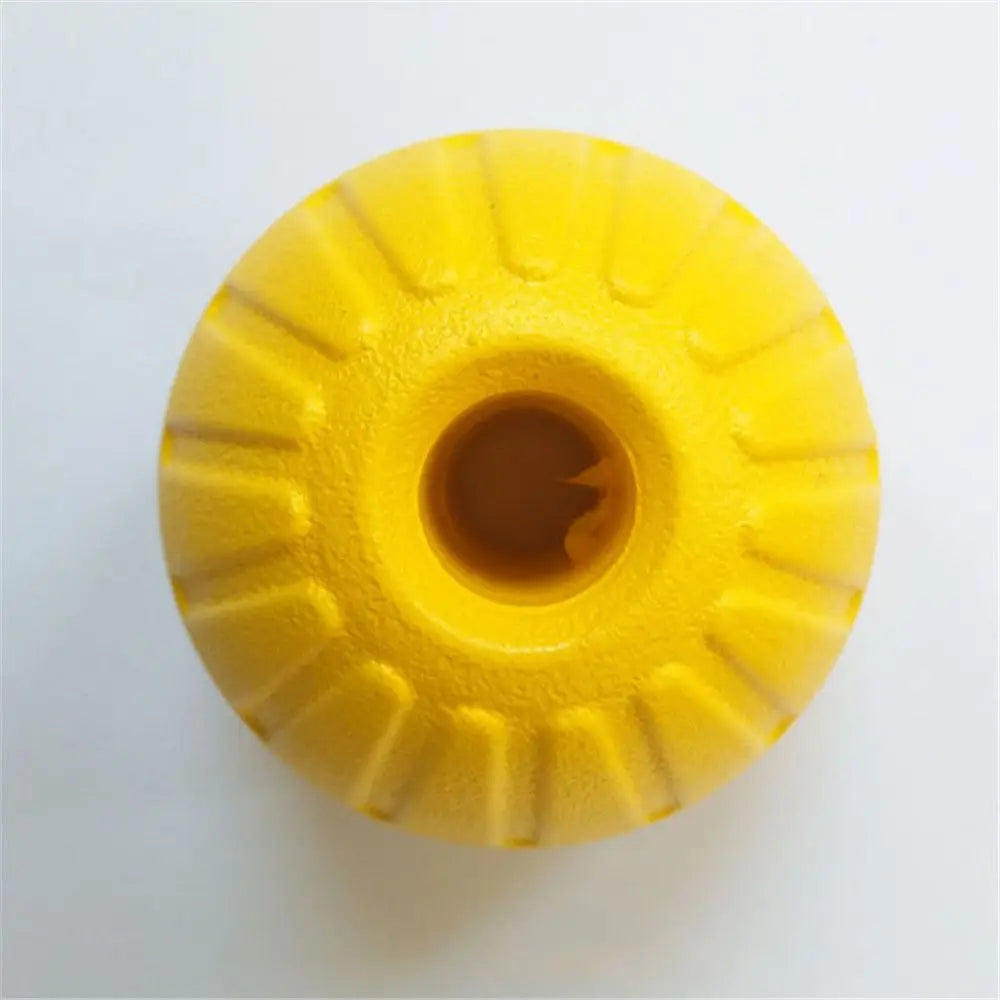 A bright yellow, durable rubber fetch ball with ribbed texture.