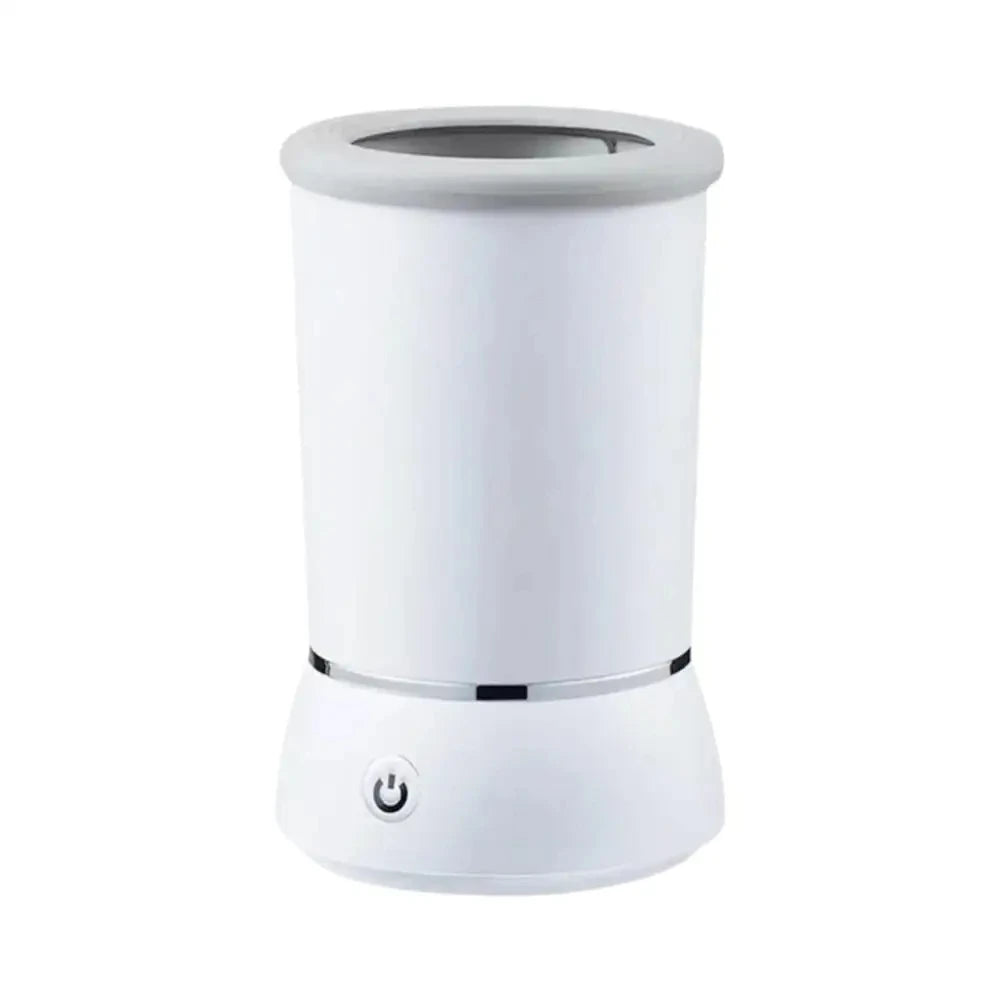 A white automatic pet paw cleaner cup with a cylindrical design and a charging port visible on the base.