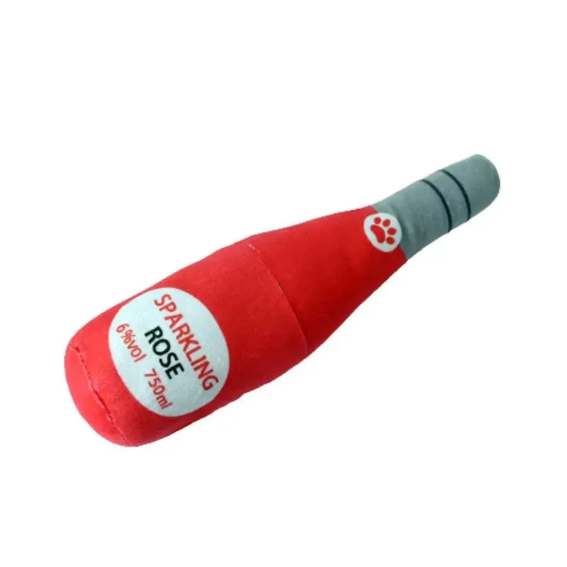 Red plush beer bottle dog toy with a squeaker and a gray cap.