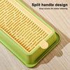 A yellow layered cat grass growing kit with a split handle design resting on a wooden surface.